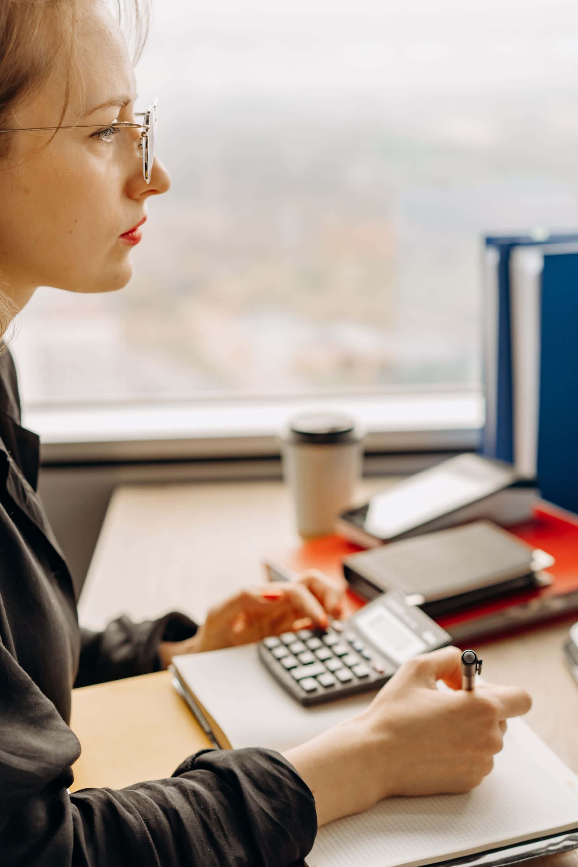 Working a figure out on a calculator at a desk