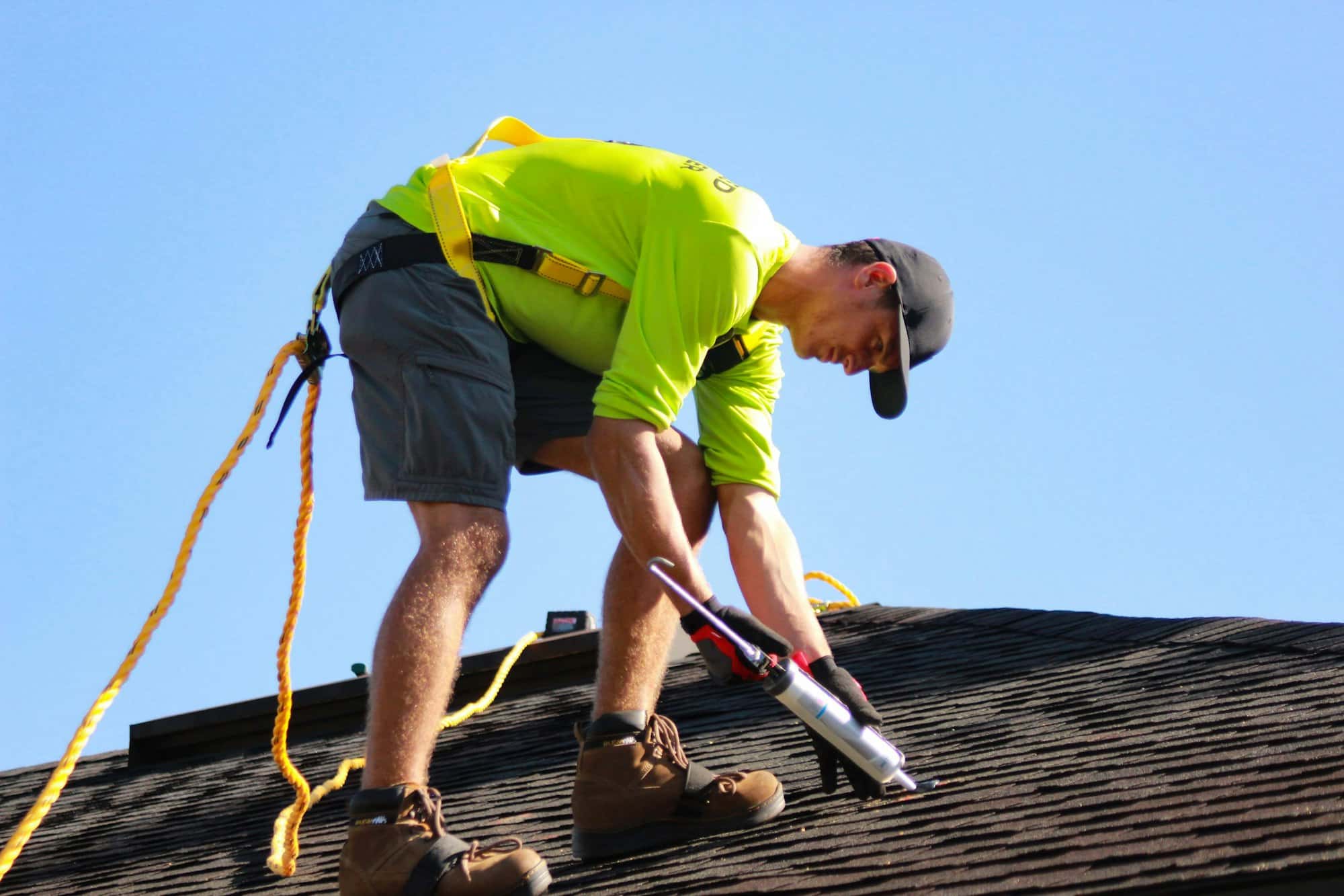 A roofer working on a pitched roof
