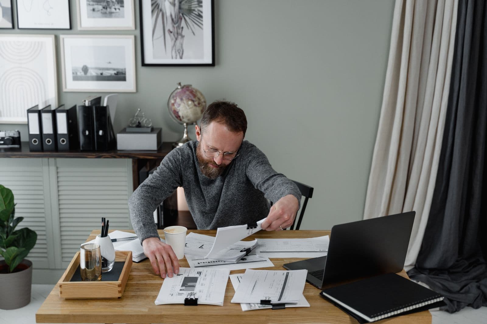 A builder going through paperwork