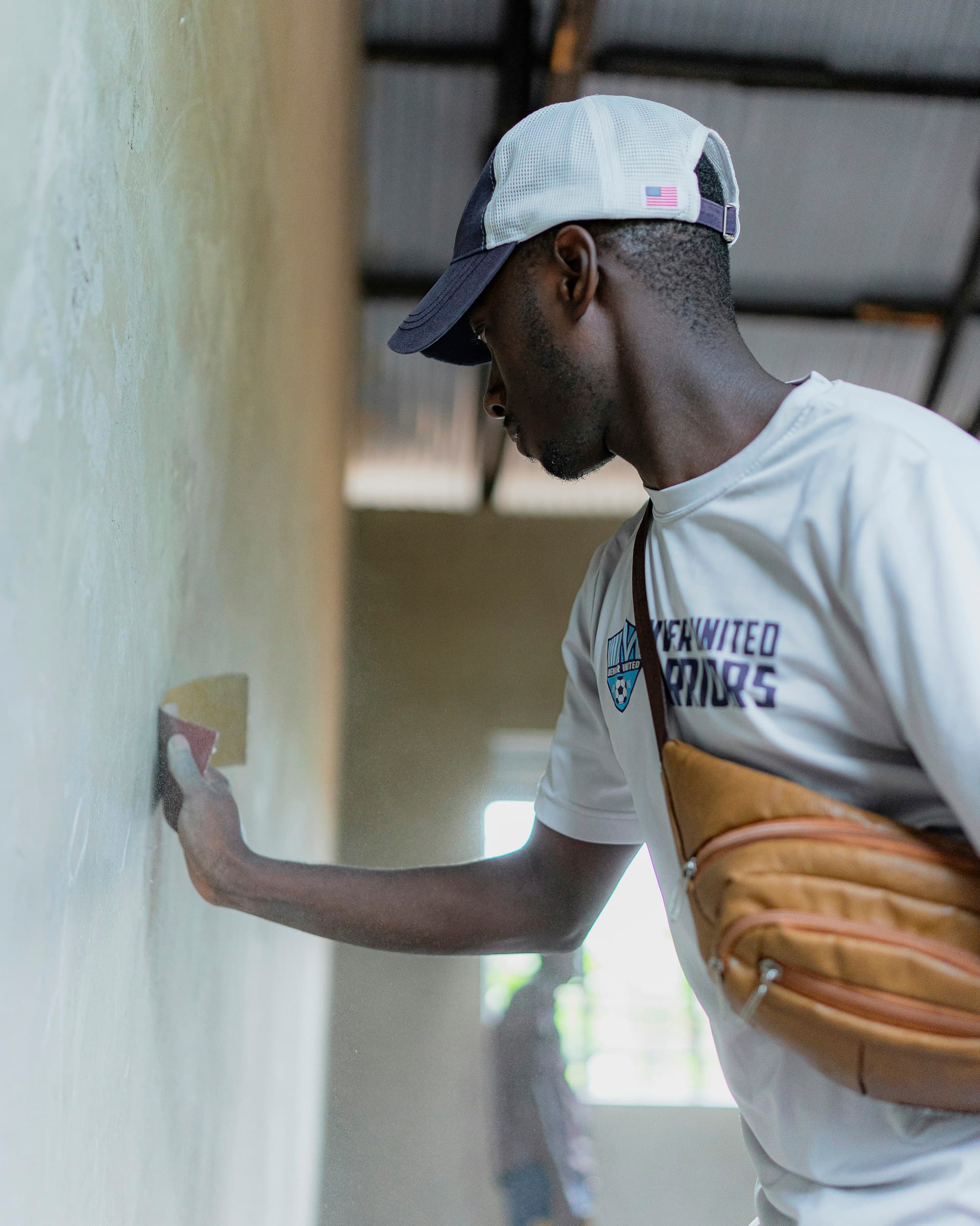 A subcontractor plastering a wall